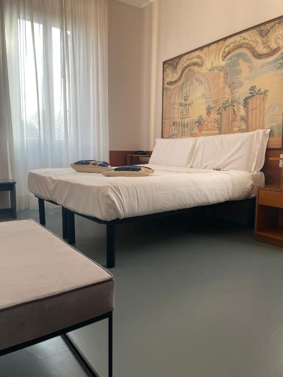 A bed or beds in a room at Hotel La Bussola