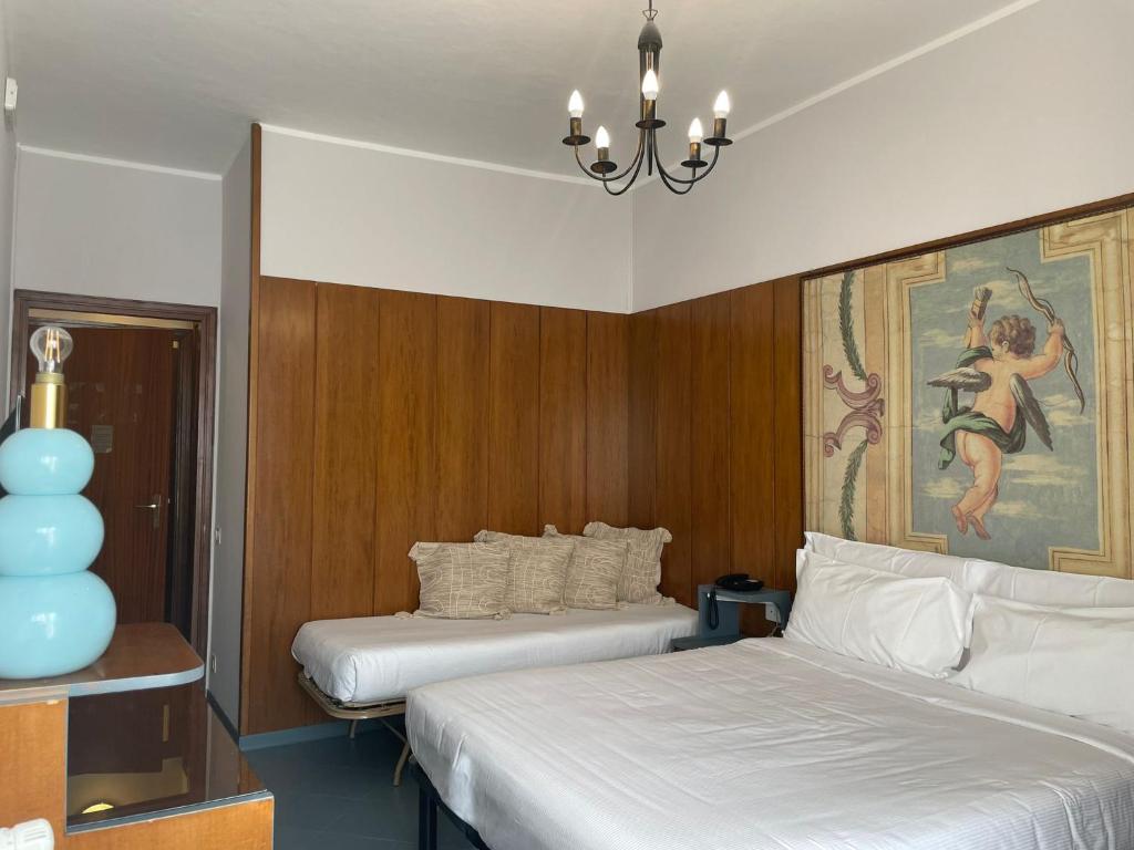 A bed or beds in a room at Hotel La Bussola