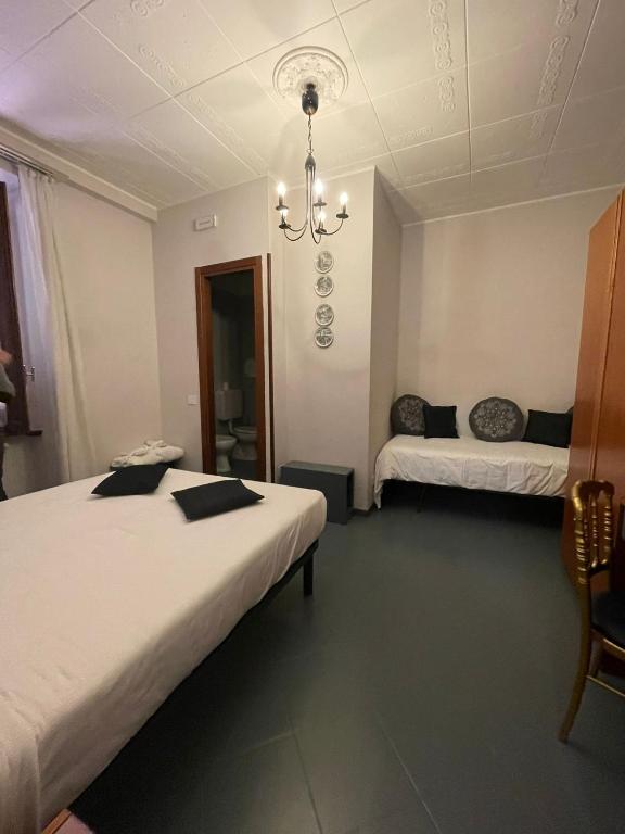 A bed or beds in a room at Hotel La Bussola