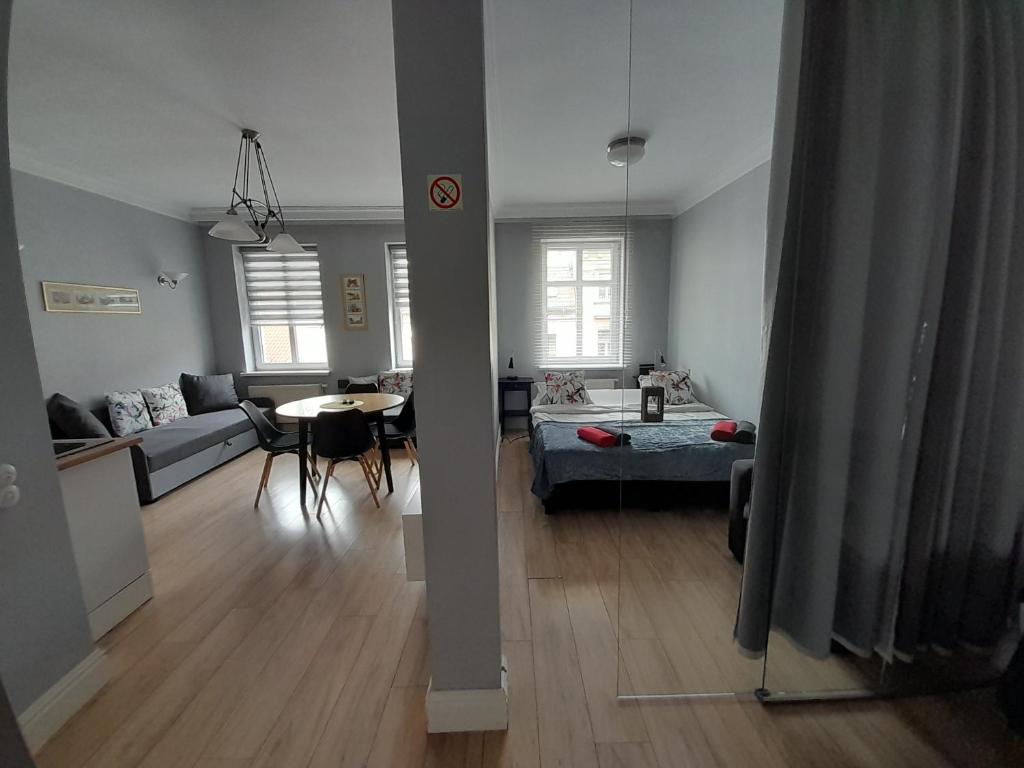 Posteľ alebo postele v izbe v ubytovaní Novitas Apartments