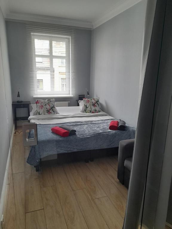 Posteľ alebo postele v izbe v ubytovaní Novitas Apartments