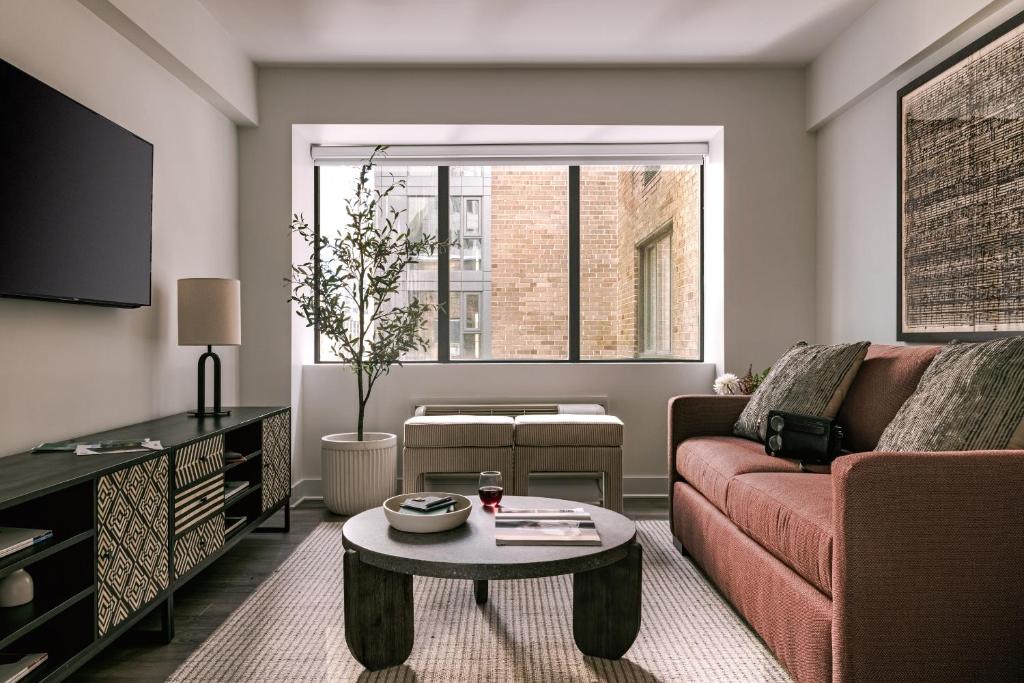 a living room with a couch and a coffee table at Sonder Arlo in Ottawa