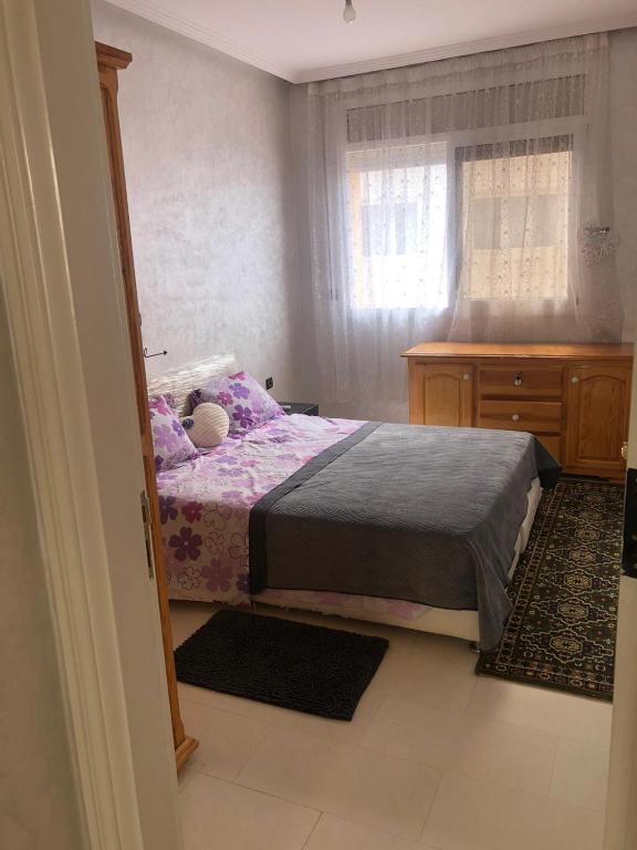 Postel nebo postele na pokoji v ubytování Joli appartement Saïdia