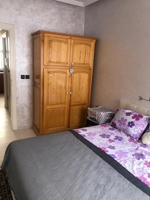 Postel nebo postele na pokoji v ubytování Joli appartement Saïdia