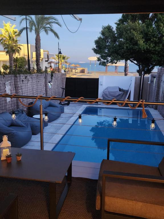 a view of a swimming pool on top of a building at Casa de Almano - Torremolinos direct on beach in Torremolinos