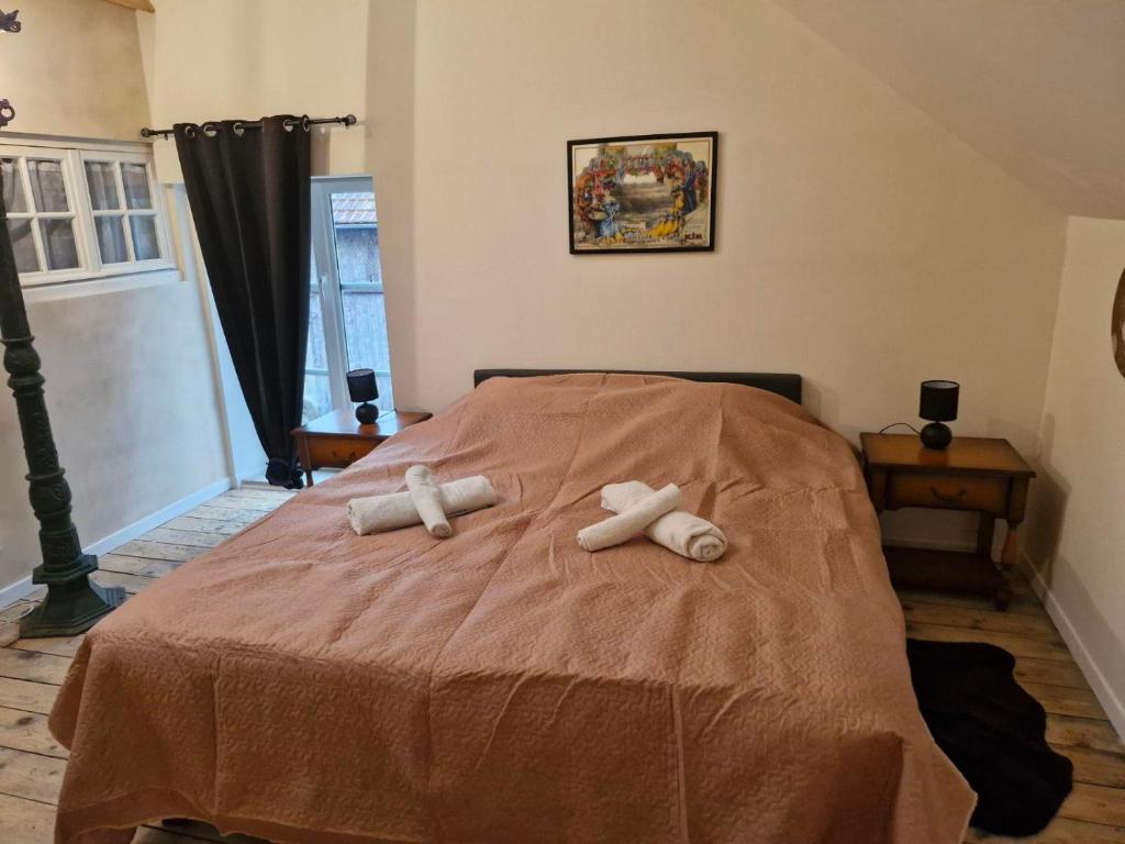 Postel nebo postele na pokoji v ubytování L'orée du lac - Formule Chambres