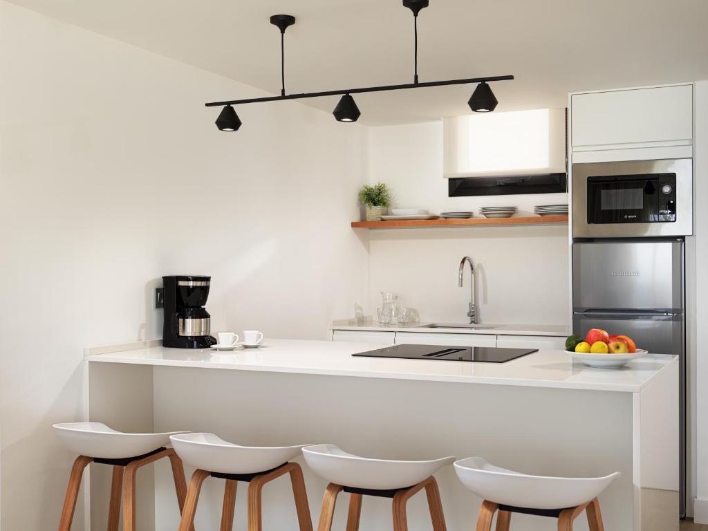 A kitchen or kitchenette at XQ Vistamar