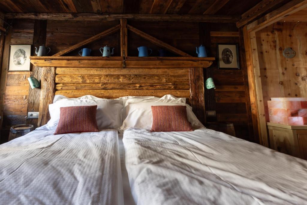 Letto o letti in una camera di Café Quinson Relais de Charme
