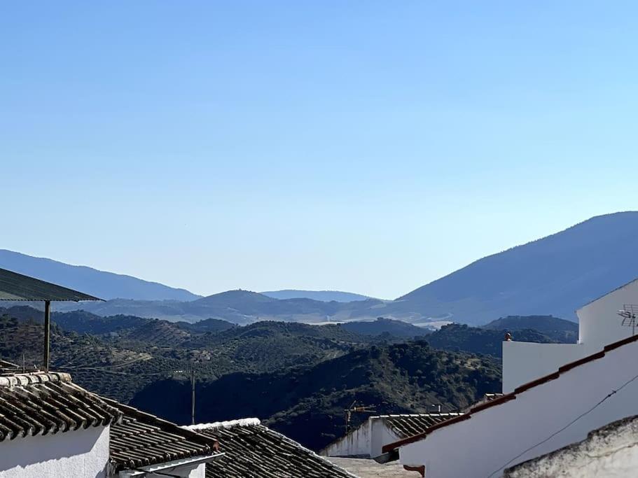 a view of the mountains from the roofs of houses at Casa Encantadora in Olvera