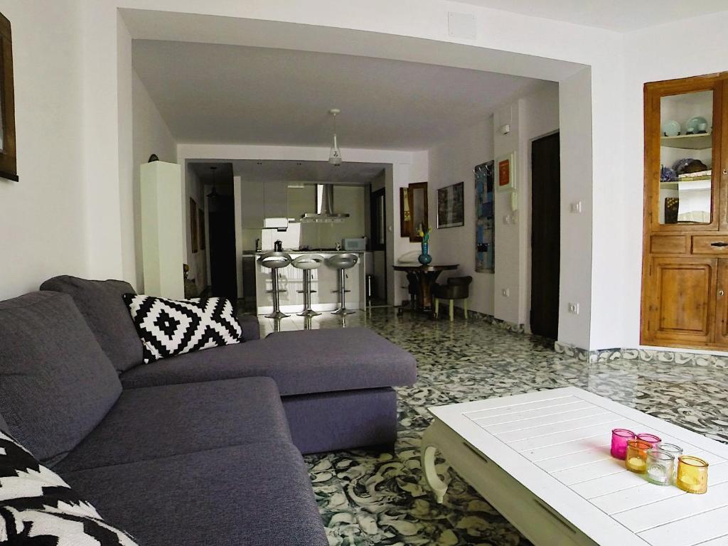 a living room with a couch and a table at Apartment PaCa Javea in Jávea