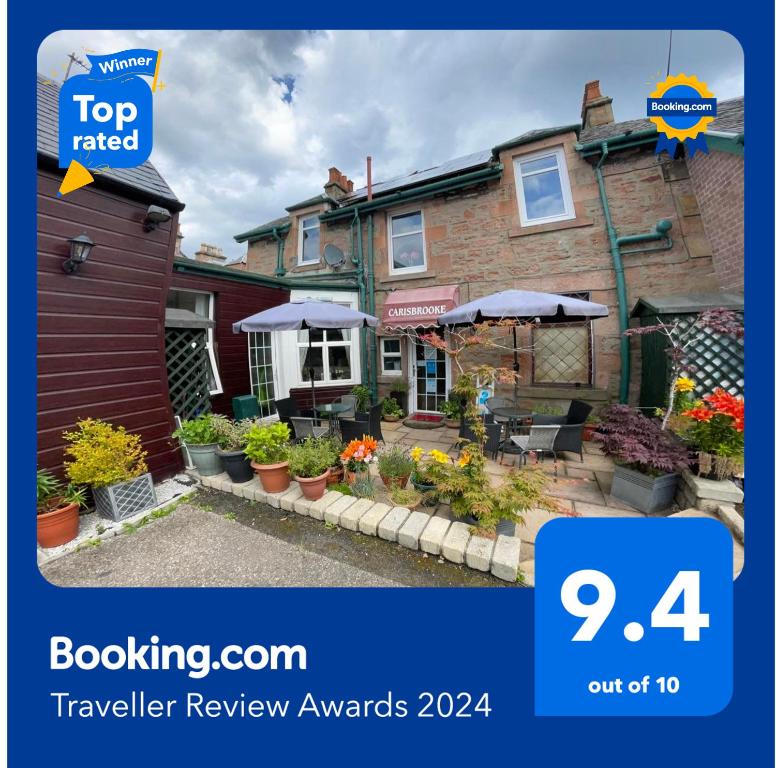 a flyer for a travel review awards with a house at Carisbrooke Guest House in Inverness