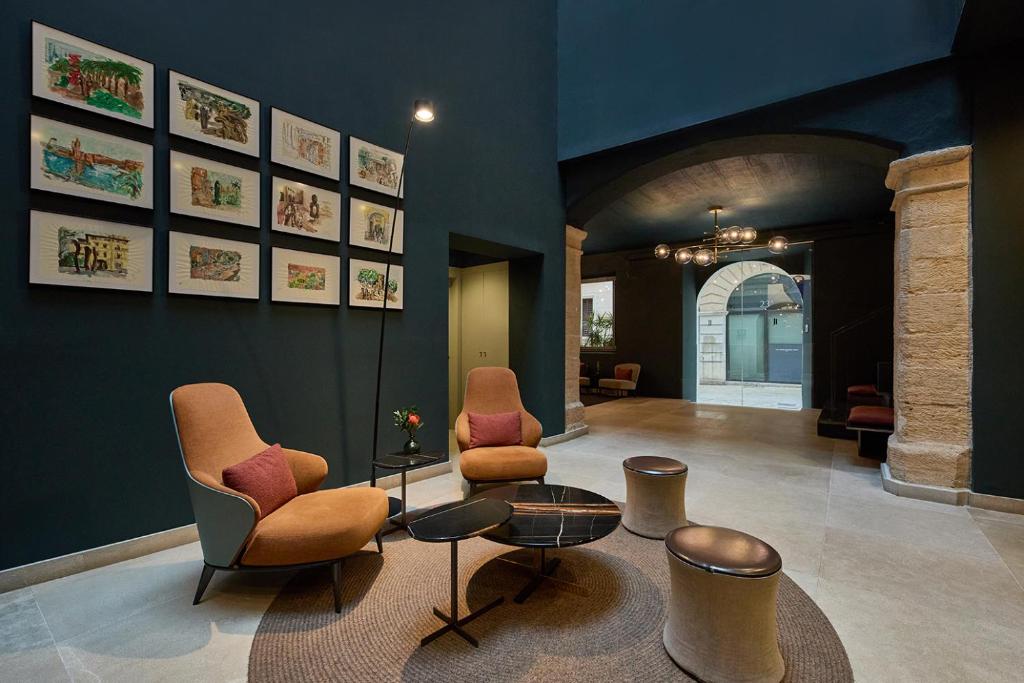 a living room with two chairs and a table at Sant Jaume Design Hotel in Palma de Mallorca