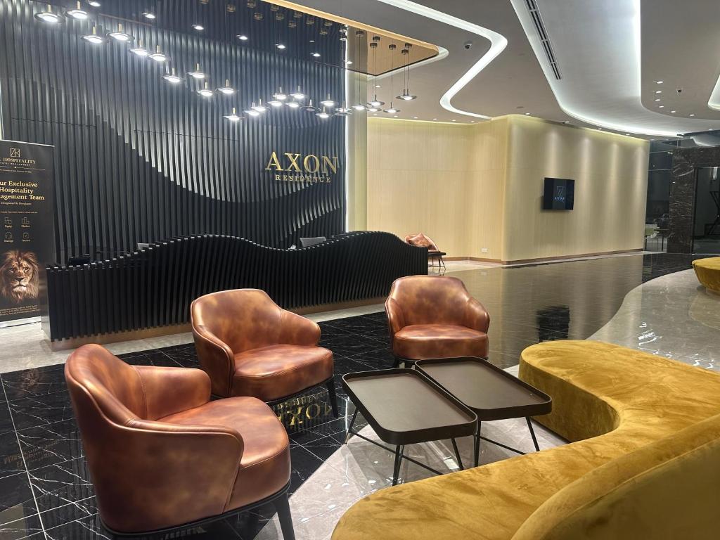 a salon with leather chairs and a waiting room at AXON RESIDENCE AT BUKIT BiNTANG KUALA LAMPUR in Kuala Lumpur