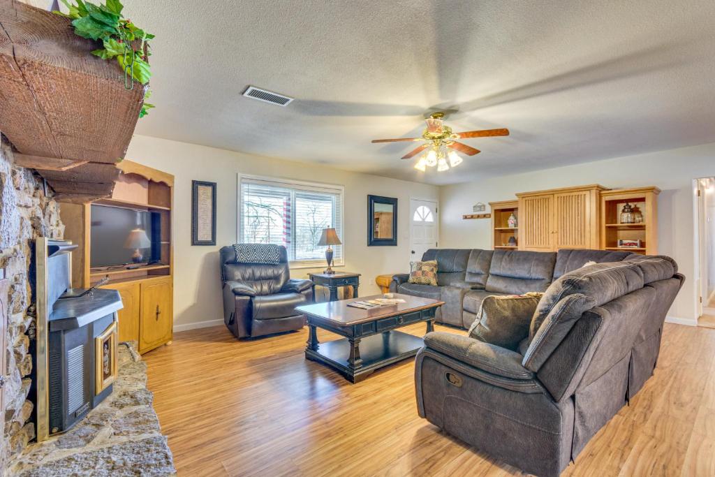 a living room with a couch and a tv at Searcy Retreat Home Near Little Red River in Searcy