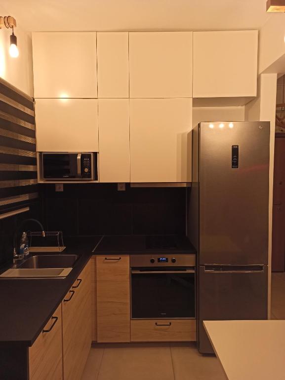 Kuchyň nebo kuchyňský kout v ubytování Luxury Little Loft Heaven