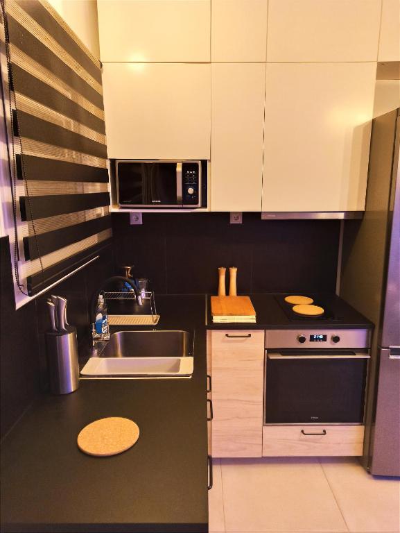 Kuchyň nebo kuchyňský kout v ubytování Luxury Little Loft Heaven