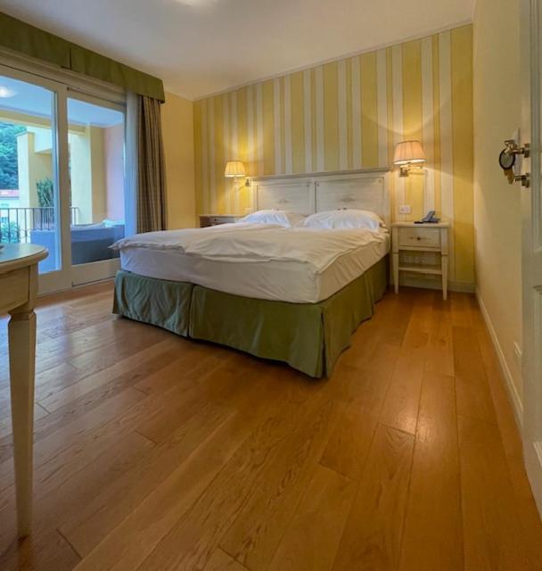Postel nebo postele na pokoji v ubytování Villa Palmira Kinderfreies Hotel