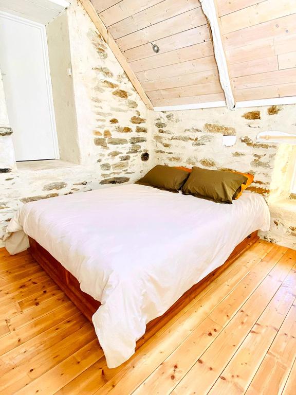 Postel nebo postele na pokoji v ubytování Le Cinquante