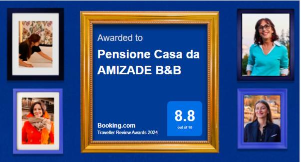 a picture frame with pictures in a blue wall at Pensione Casa da AMIZADE B&B in Pedra Badejo