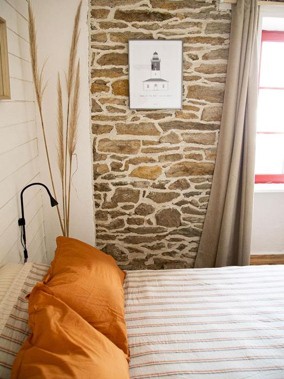 Postel nebo postele na pokoji v ubytování Le Cinquante