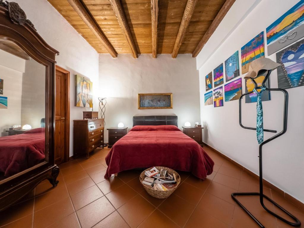 a bedroom with two beds and a mirror in it at Casa Ruggiero in Palermo