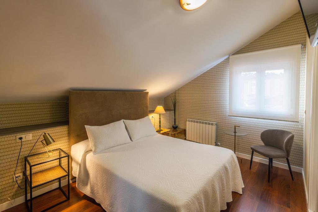 Postel nebo postele na pokoji v ubytování Hotel Verdemar