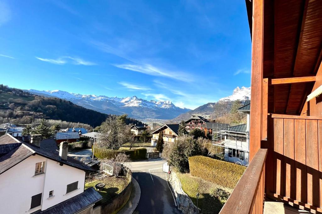 a view of the mountains from the balcony of a house at Apartment with balcony and exceptional view in Saint-Gervais-les-Bains