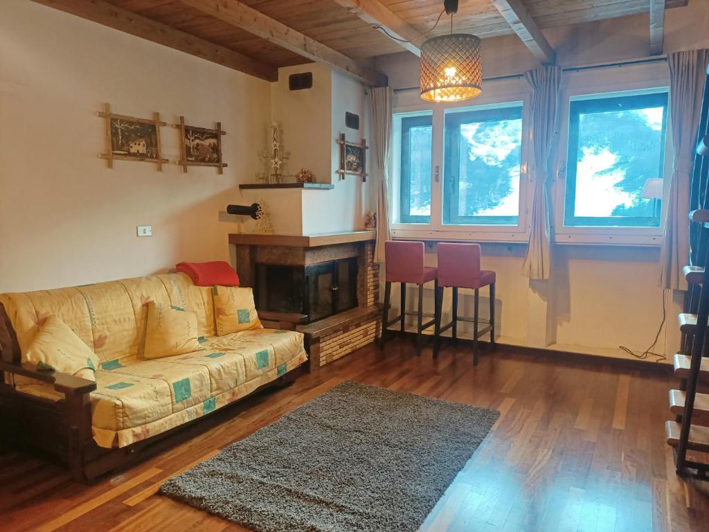 a living room with a couch and a fireplace at Matese Home in San Massimo