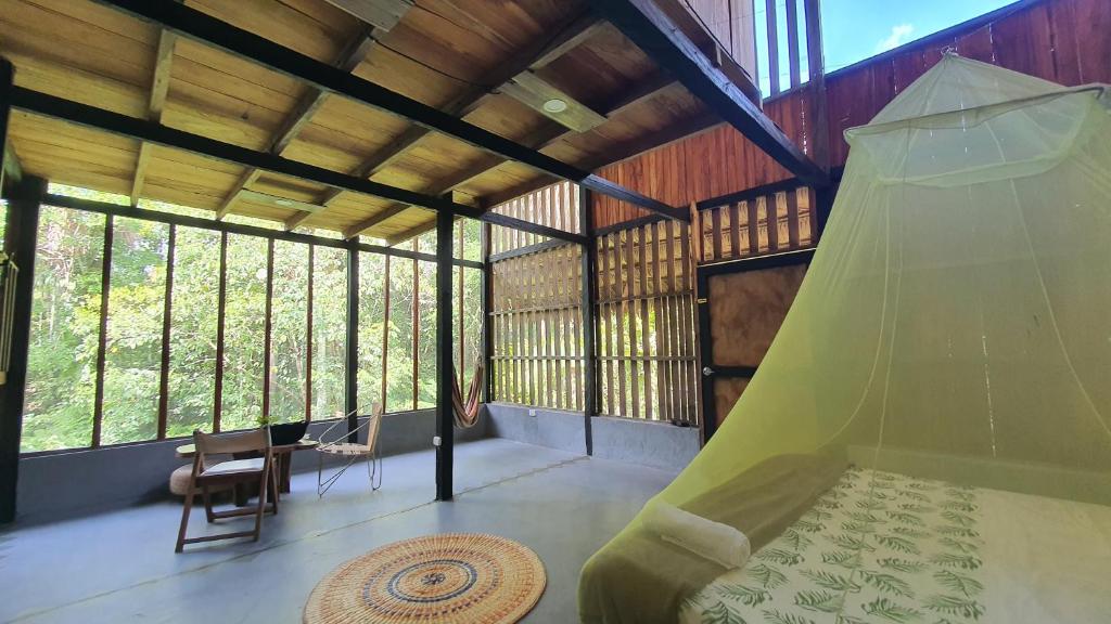 a room with a hammock in a tree house at Amazona Lodge in Leticia