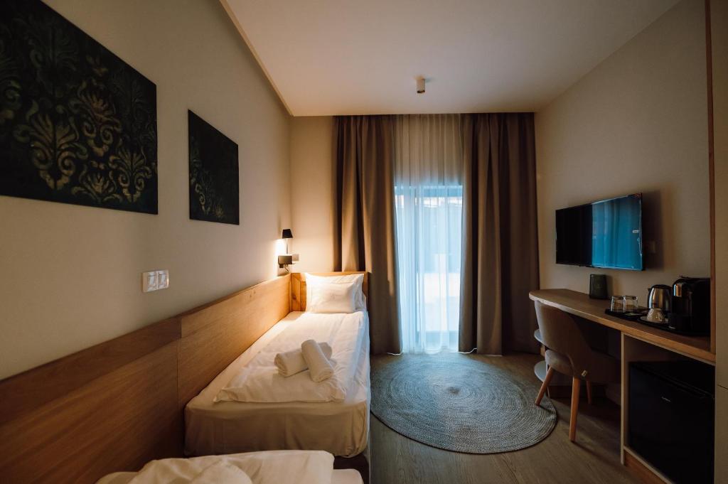Postel nebo postele na pokoji v ubytování Pensiunea Sylvania