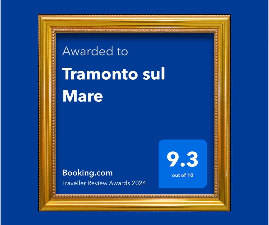 a gold picture frame with a thermomed to tramontino sunmage at Tramonto sul Mare in Framura