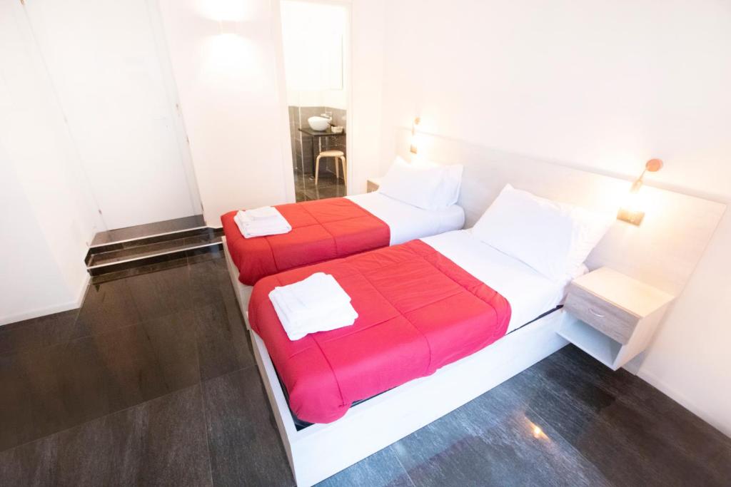 Łóżko lub łóżka w pokoju w obiekcie Hall inn B&B in Chiostro