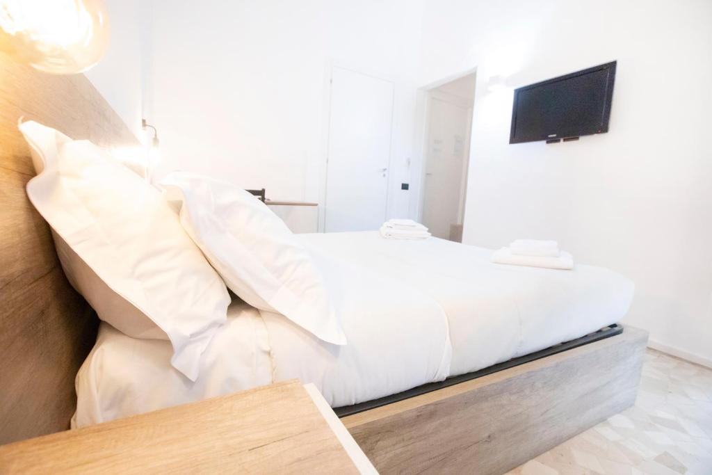 Łóżko lub łóżka w pokoju w obiekcie Hall inn B&B in Chiostro