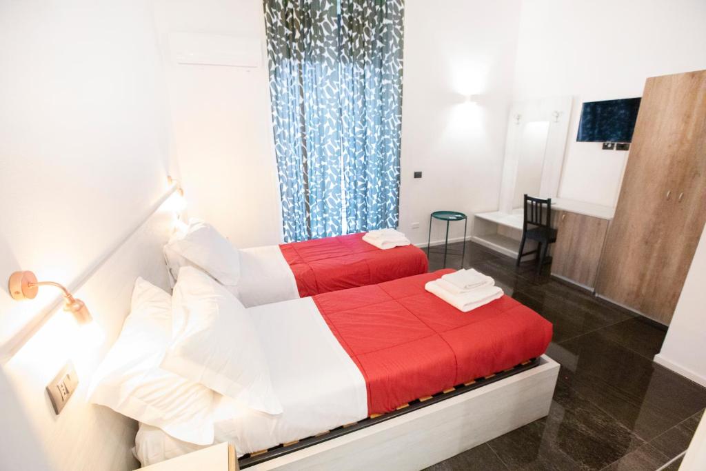 Łóżko lub łóżka w pokoju w obiekcie Hall inn B&B in Chiostro