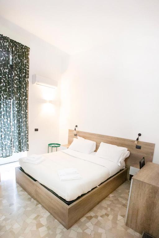 Łóżko lub łóżka w pokoju w obiekcie Hall inn B&B in Chiostro