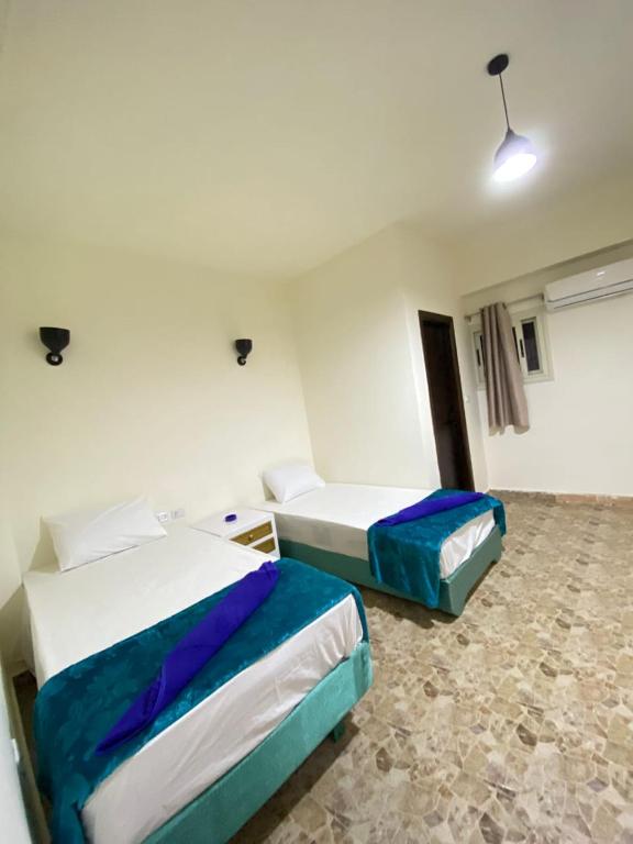 Postel nebo postele na pokoji v ubytování Brother Hotel Dahab
