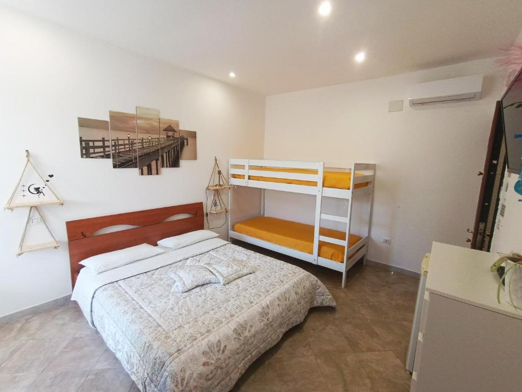 Postel nebo postele na pokoji v ubytování B&B il MENHIR