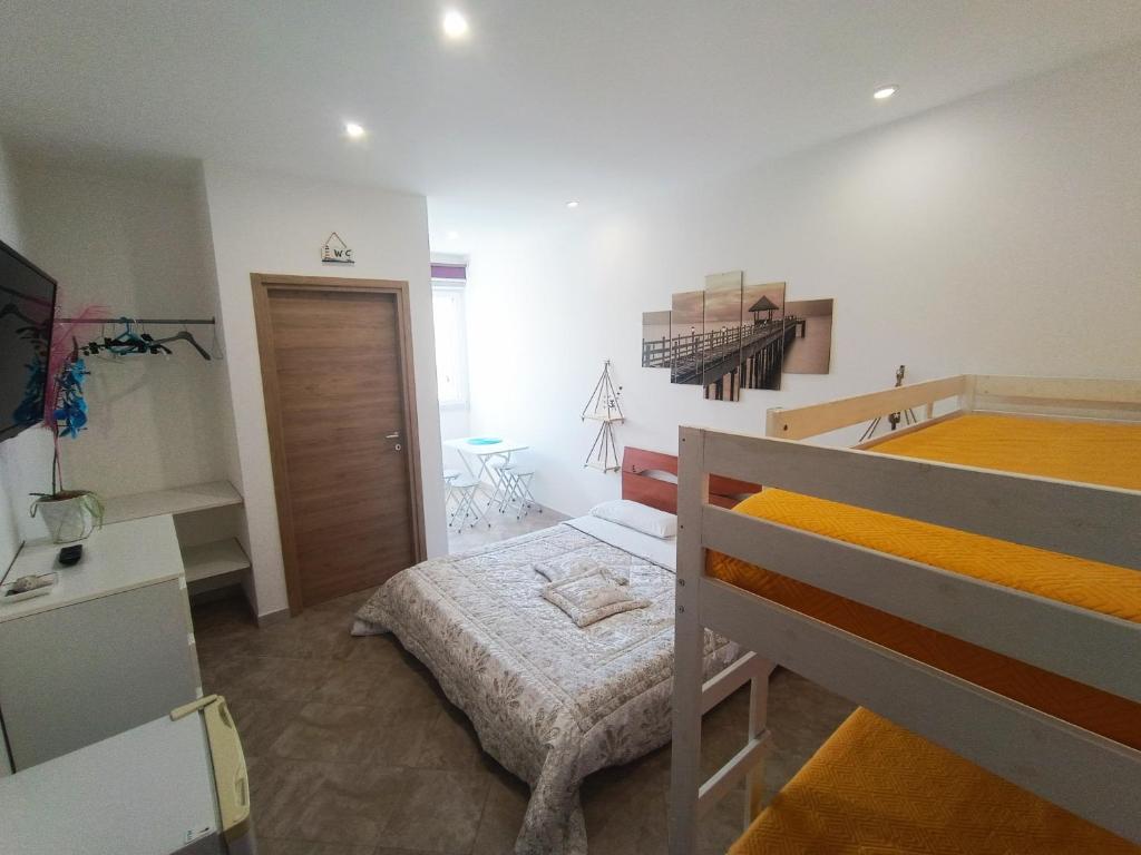 Postel nebo postele na pokoji v ubytování B&B il MENHIR