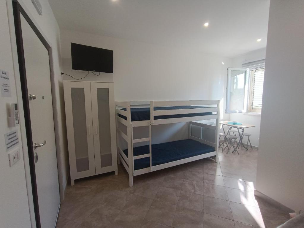 Postel nebo postele na pokoji v ubytování B&B il MENHIR