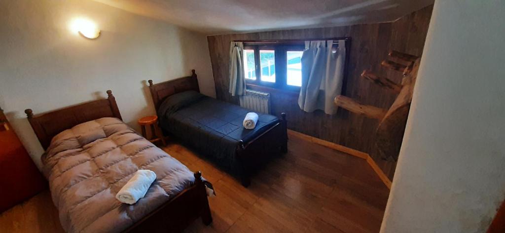 Postel nebo postele na pokoji v ubytování Hostería Copahue