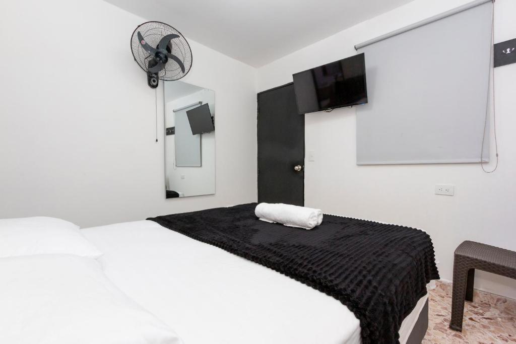 Postel nebo postele na pokoji v ubytování Hotel De León Estadio
