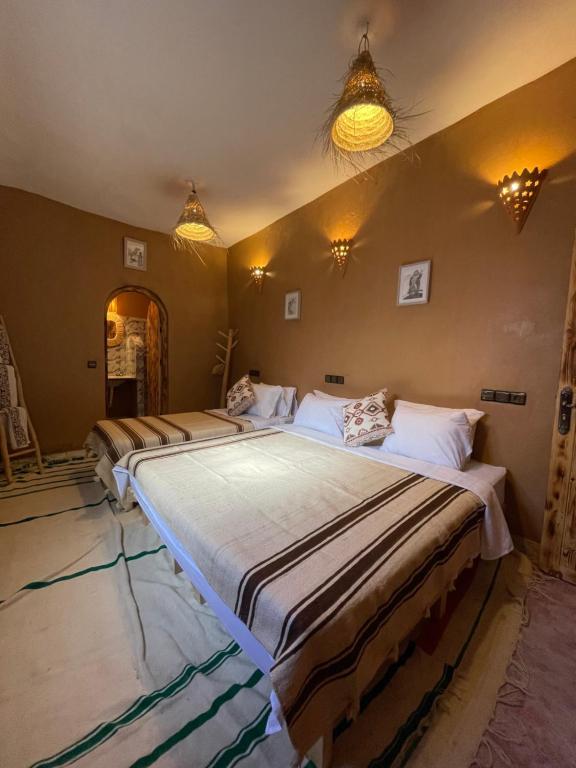 Ліжко або ліжка в номері Dar Nomads