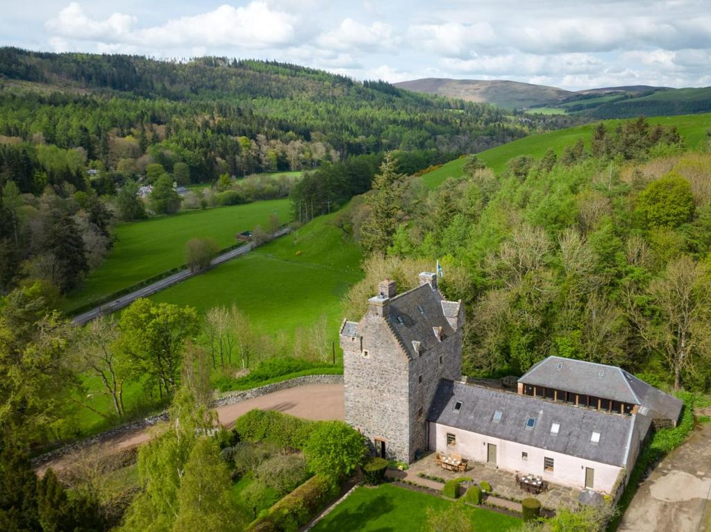 an aerial view of an old castle in a field at 5 Bed in Selkirk TOWER in Selkirk