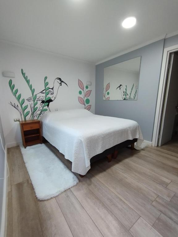 Postel nebo postele na pokoji v ubytování HOSTAL LA MODERNA