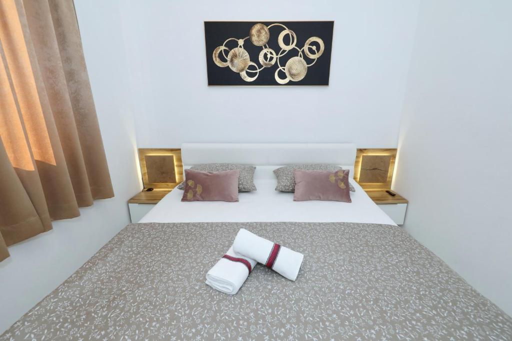 Postel nebo postele na pokoji v ubytování Orchid Stay