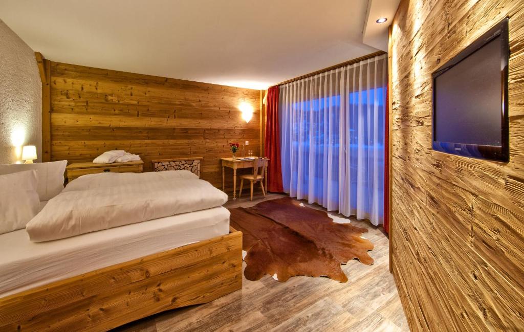 TV a/nebo společenská místnost v ubytování Arosa Vetter Hotel