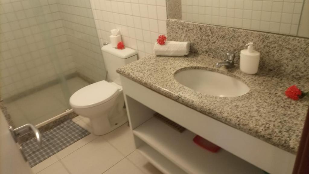 a bathroom with a toilet and a sink at Nannai Residence, Beira-mar - Porto de Galinhas / Muro Alto (BDJ06) in Porto De Galinhas