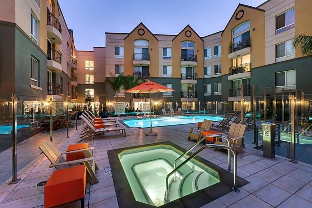 a swimming pool with a hot tub in a building at Cozy Home Management in MDR in Los Angeles