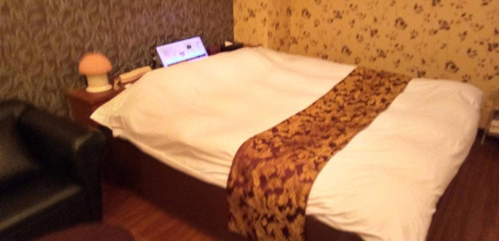 Postel nebo postele na pokoji v ubytování ホテル ココアミルク