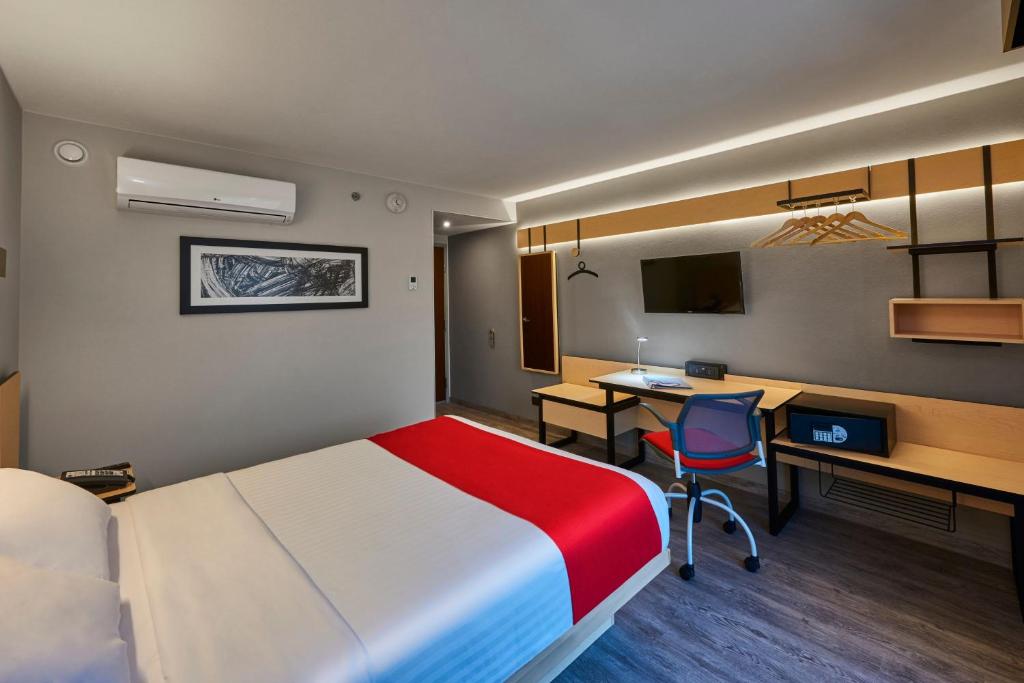 Postel nebo postele na pokoji v ubytování City Express Plus by Marriott Leon Centro de Convenciones